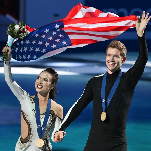 FILE - Madison Chock and Evan Bates, of the United States, wave to fans as they celebrate their victory in the ice dance competition at the ISU World Figure Skating Championships in Montreal, March 23, 2024. (Graham Hughes/The Canadian Press via AP, File)