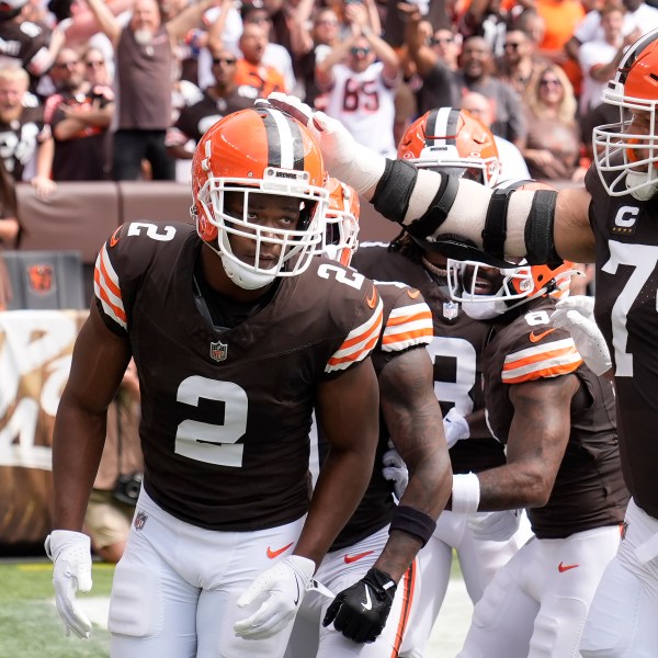 Cleveland Browns wide receiver Amari Cooper (2) is congratulated by guard Joel Bitonio (75) after scoring against the New York Giants during the first half of an NFL football game, Sunday, Sept. 22, 2024 in Cleveland. (AP Photo/Sue Ogrocki)