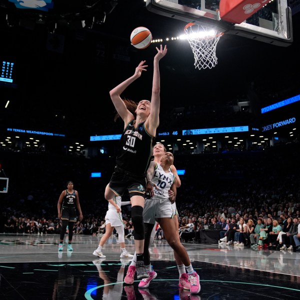 New York Liberty's Breanna Stewart (30) shoots during the first half in Game 2 of a WNBA basketball final playoff series against the Minnesota Lynx, Sunday, Oct. 13, 2024, in New York. (AP Photo/Pamela Smith)