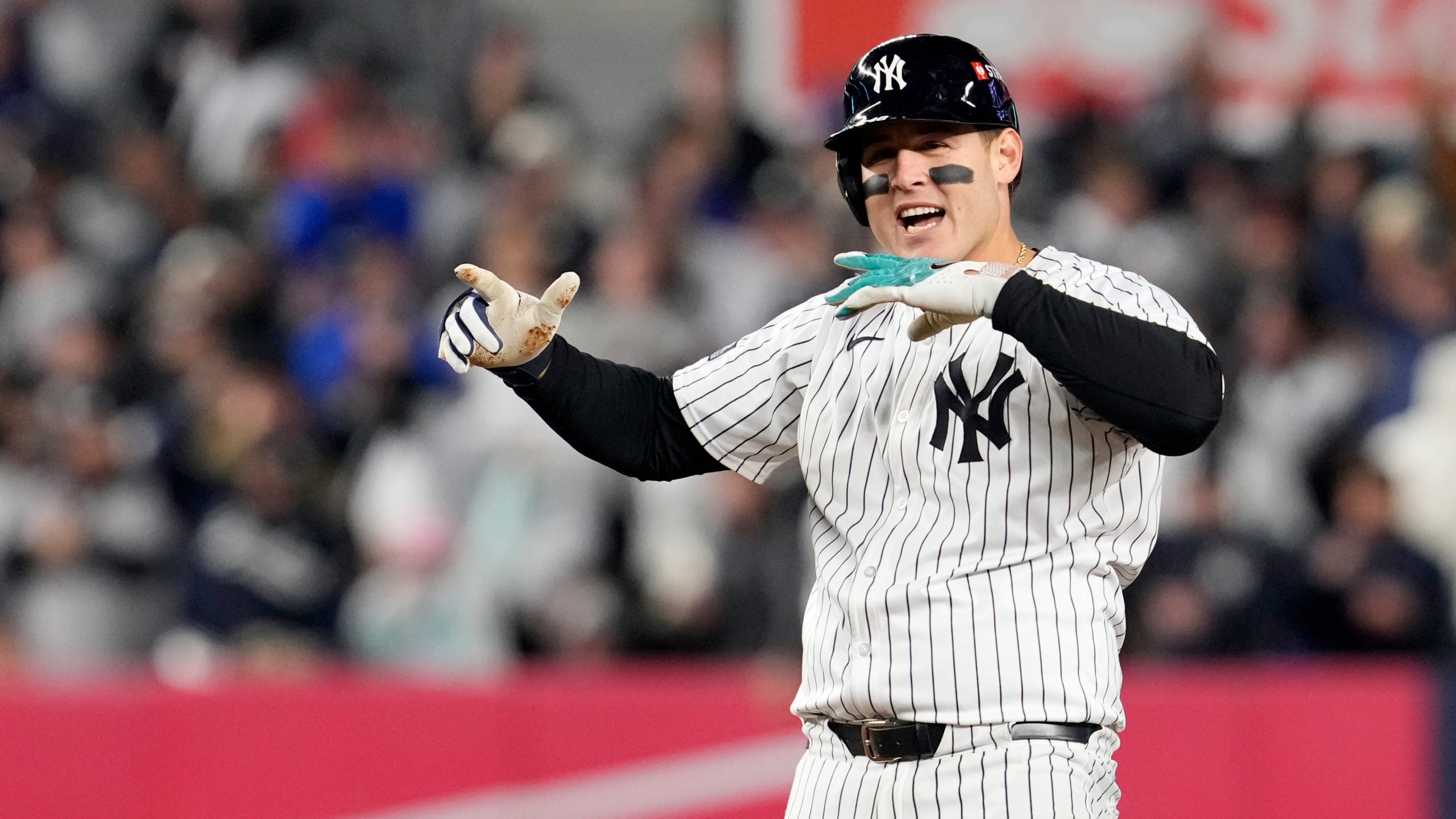 New York Yankees' Anthony Rizzo celebrates after hitting a RBI double against the Cleveland Guardians during the sixth inning in Game 2 of the baseball AL Championship Series Tuesday, Oct. 15, 2024, in New York. (AP Photo/Godofredo Vásquez)