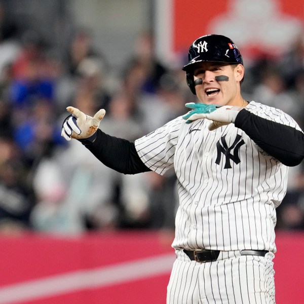 New York Yankees' Anthony Rizzo celebrates after hitting a RBI double against the Cleveland Guardians during the sixth inning in Game 2 of the baseball AL Championship Series Tuesday, Oct. 15, 2024, in New York. (AP Photo/Godofredo Vásquez)