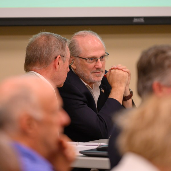 Challenger Steven Bartelski and EagleAI CEO Rick Richards present challenges to the Forsyth election board concerning the eligibility of 800 voters at the Forsyth County Voter Registrar in Cumming, Ga., June 28, 2024. (Jamie Spaar /Atlanta Journal-Constitution via AP)