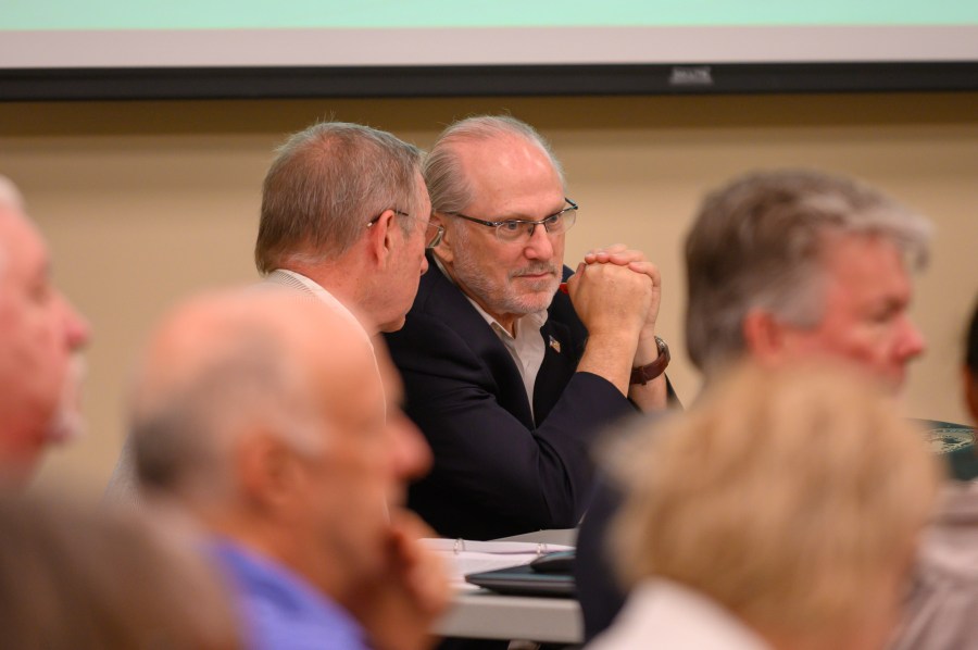 Challenger Steven Bartelski and EagleAI CEO Rick Richards present challenges to the Forsyth election board concerning the eligibility of 800 voters at the Forsyth County Voter Registrar in Cumming, Ga., June 28, 2024. (Jamie Spaar /Atlanta Journal-Constitution via AP)