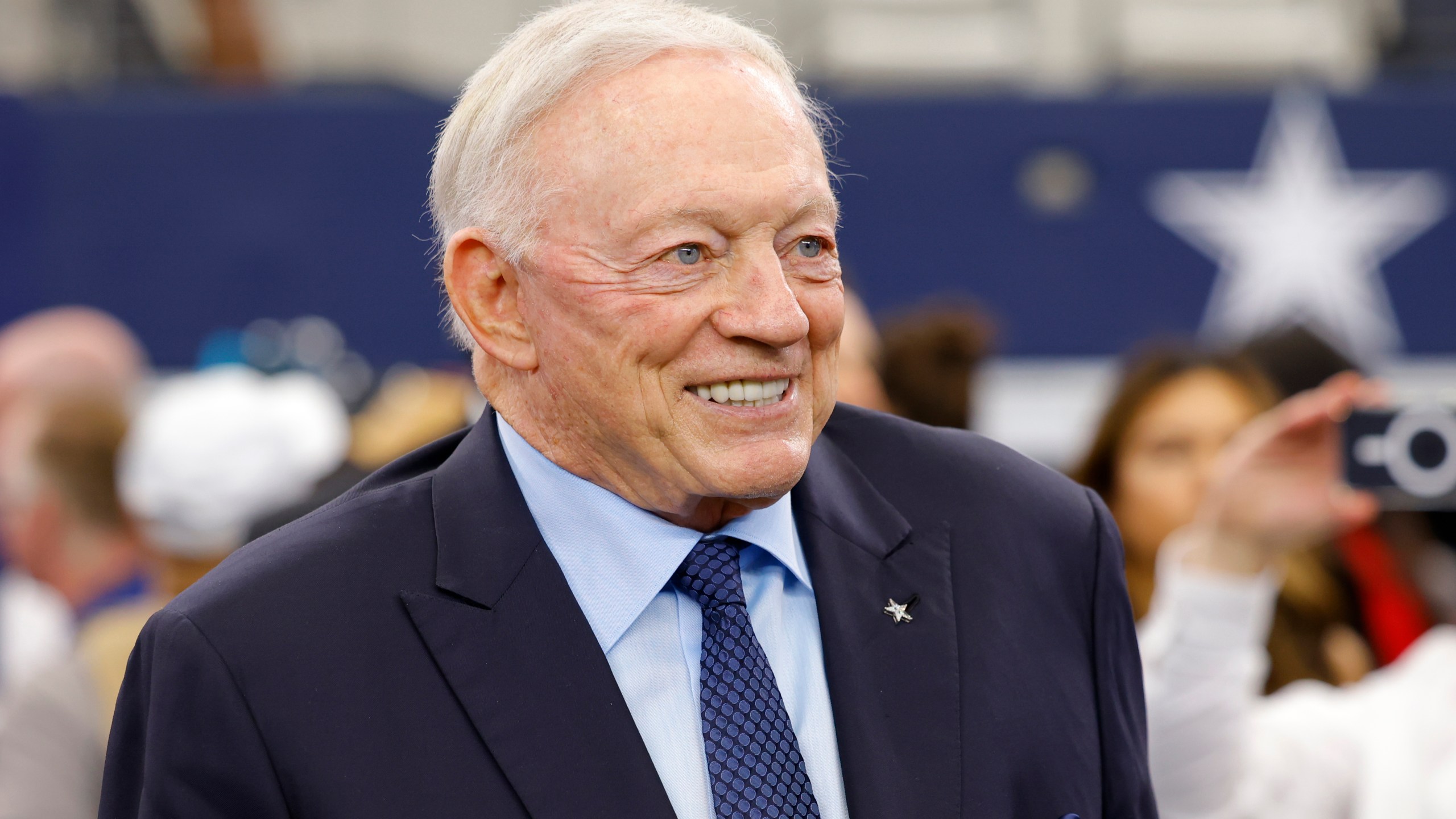 Dallas Cowboys team owner Jerry Jones stands on the field during warmups before an NFL football game against the Detroit Lions in Arlington, Texas, Sunday, Oct. 13, 2024. (AP Photo/Gareth Patterson)