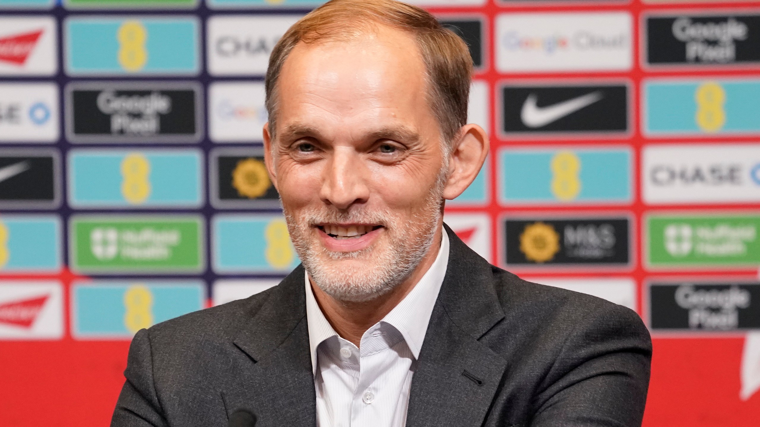 The newly appointed England men's soccer team manager Thomas Tuchel smiles as he speaks during a press conference held at Wembley Stadium in London, Wednesday, Oct. 16, 2024. (AP Photo/Alberto Pezzali)