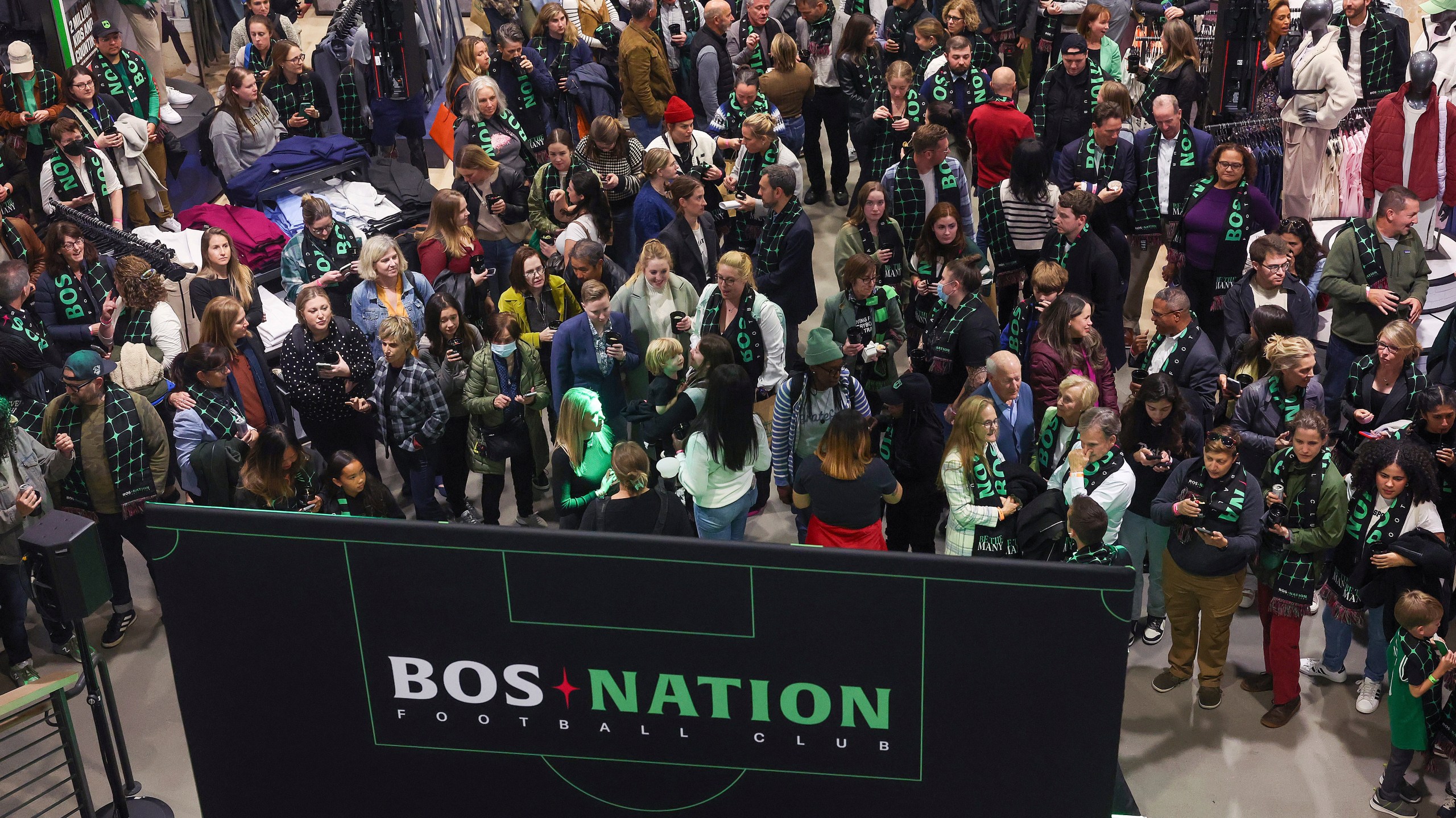 Fans gather during a kickoff celebration for National Women's Soccer League's Boston franchise, which is to be named BOS Nation Football Club, Tuesday, Oct.. 15, 2024, in Boston. (Barry Chin/The Boston Globe via AP)