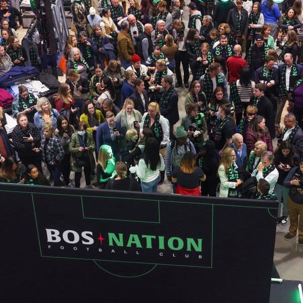 Fans gather during a kickoff celebration for National Women's Soccer League's Boston franchise, which is to be named BOS Nation Football Club, Tuesday, Oct.. 15, 2024, in Boston. (Barry Chin/The Boston Globe via AP)