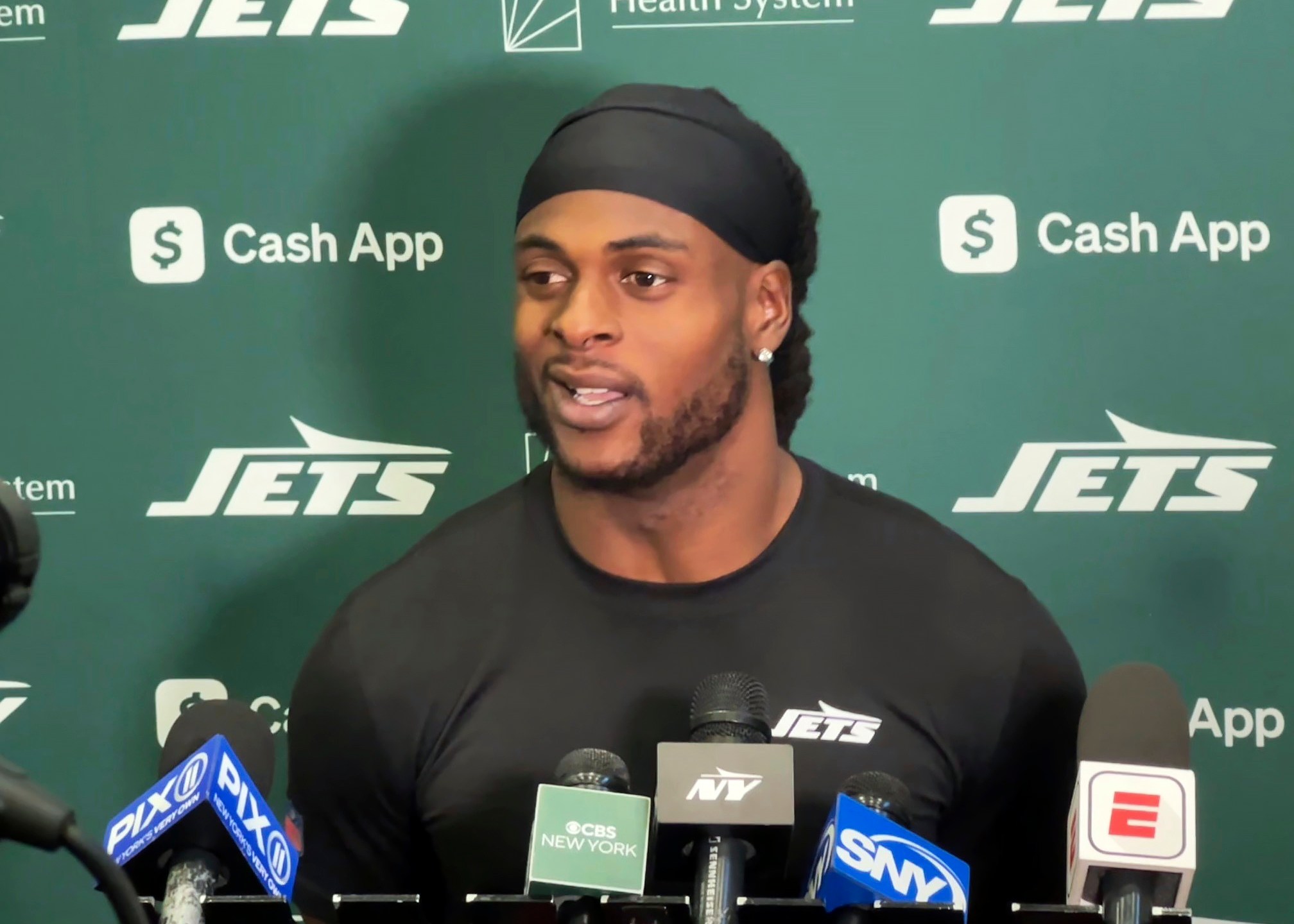 New York Jets wide receiver Davante Adams speaks to reporters at the team's facility in Florham Park, N.J., on Wednesday, Oct. 16, 2024. (AP Photo/Dennis Waszak Jr.)