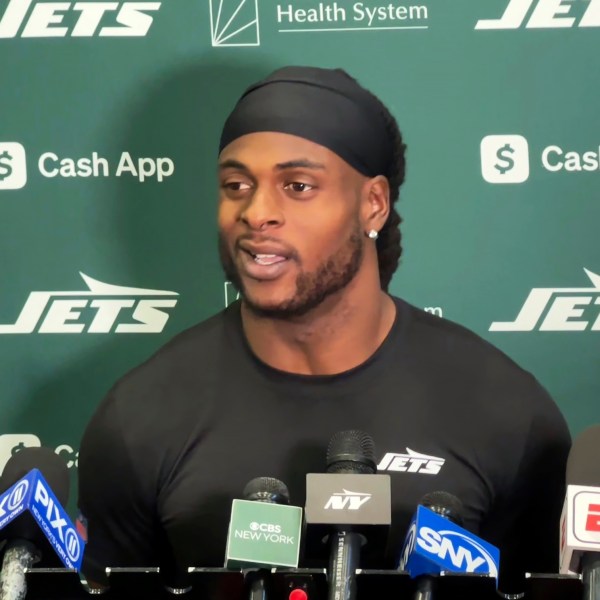 New York Jets wide receiver Davante Adams speaks to reporters at the team's facility in Florham Park, N.J., on Wednesday, Oct. 16, 2024. (AP Photo/Dennis Waszak Jr.)