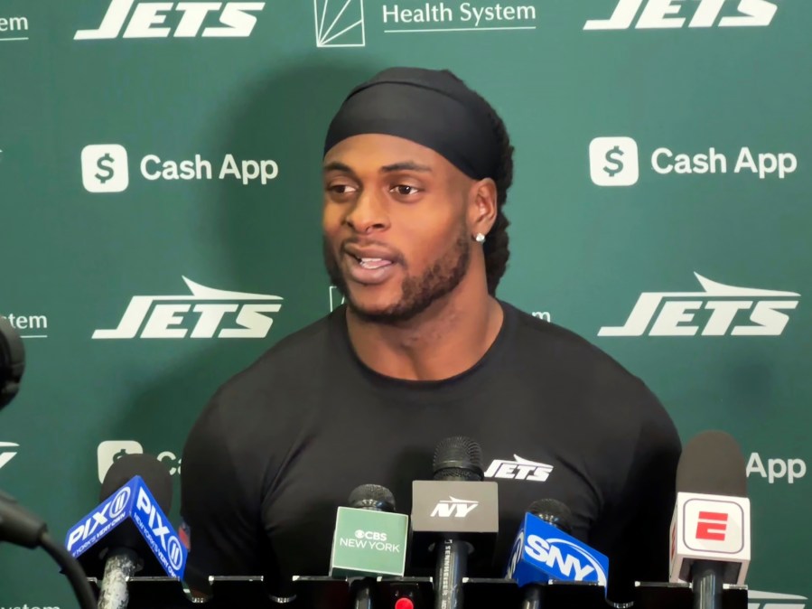 New York Jets wide receiver Davante Adams speaks to reporters at the team's facility in Florham Park, N.J., on Wednesday, Oct. 16, 2024. (AP Photo/Dennis Waszak Jr.)