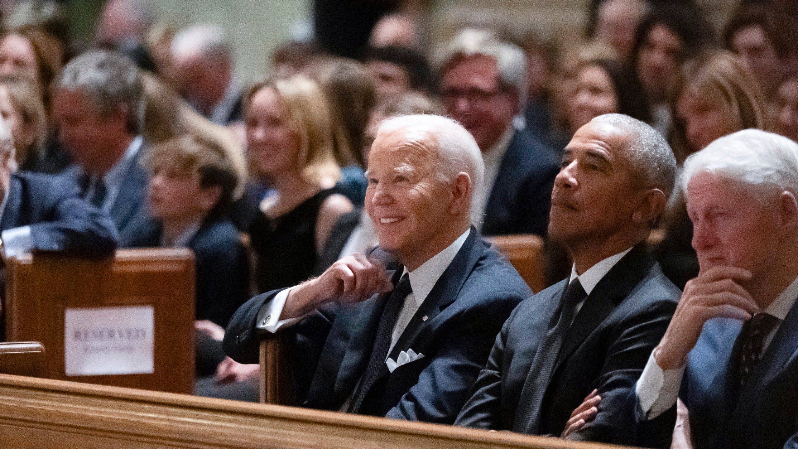 President Joe Biden, left, and former Presidents Barack Obama, center, and Bill Clinton, right, attend a memorial service for Ethel Kennedy, the wife of Sen. Robert F. Kennedy, who died on Oct. 10, 2024, at age 96, at the Cathedral of St. Matthew the Apostle in Washington, Wednesday, Oct. 16, 2024. (AP Photo/Ben Curtis)