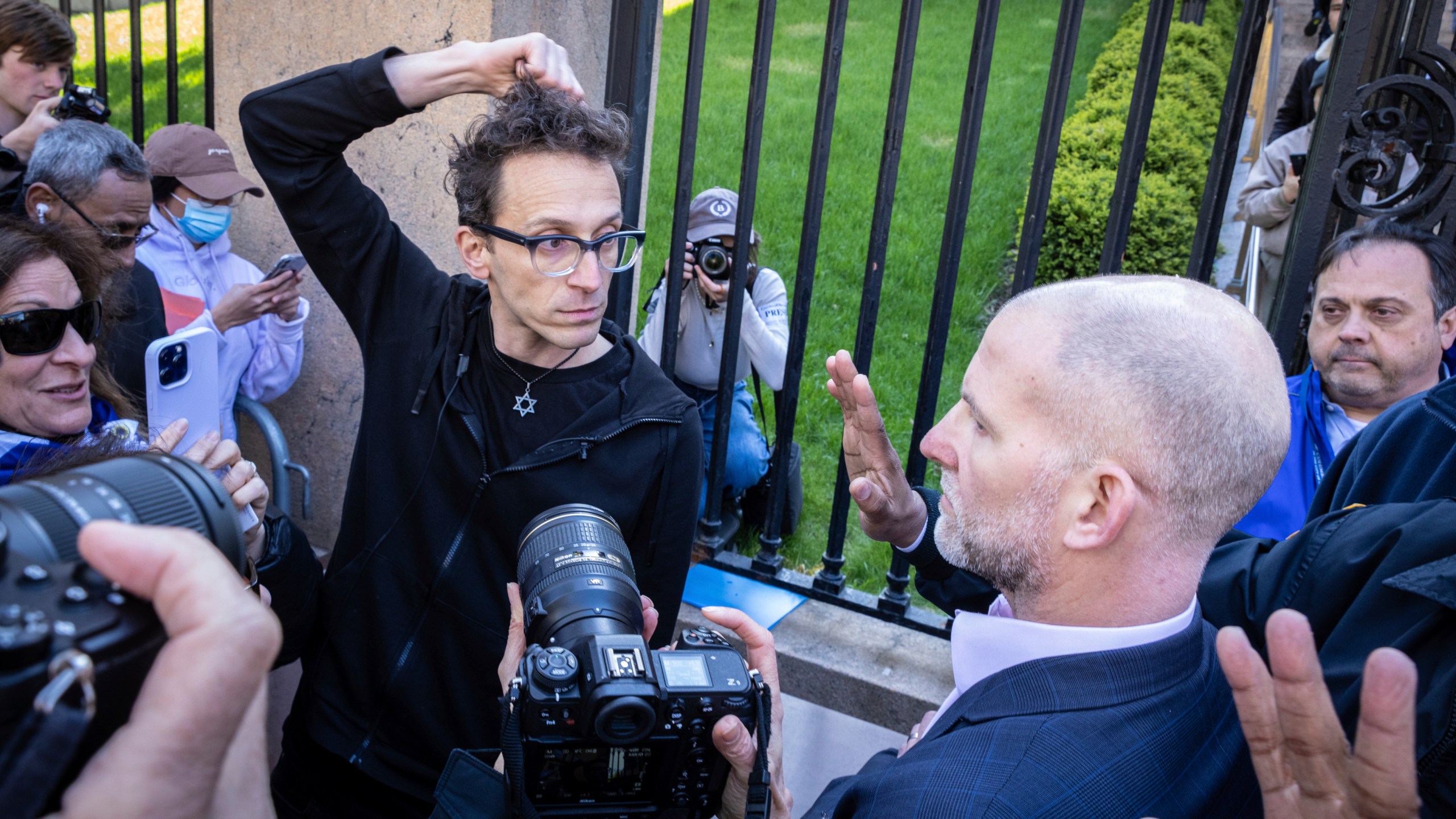 FILE - Columbia University assistant professor Shai Davidai, left, is denied access to the main campus after his security card was deactivated, to prevent him from accessing the lawn currently occupied by pro-Palestinian student demonstrators in New York, April 22, 2024. (AP Photo/Stefan Jeremiah, File)