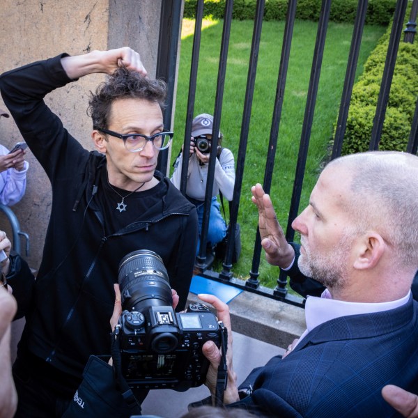 FILE - Columbia University assistant professor Shai Davidai, left, is denied access to the main campus after his security card was deactivated, to prevent him from accessing the lawn currently occupied by pro-Palestinian student demonstrators in New York, April 22, 2024. (AP Photo/Stefan Jeremiah, File)