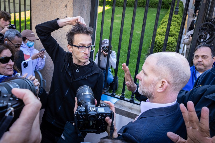 FILE - Columbia University assistant professor Shai Davidai, left, is denied access to the main campus after his security card was deactivated, to prevent him from accessing the lawn currently occupied by pro-Palestinian student demonstrators in New York, April 22, 2024. (AP Photo/Stefan Jeremiah, File)