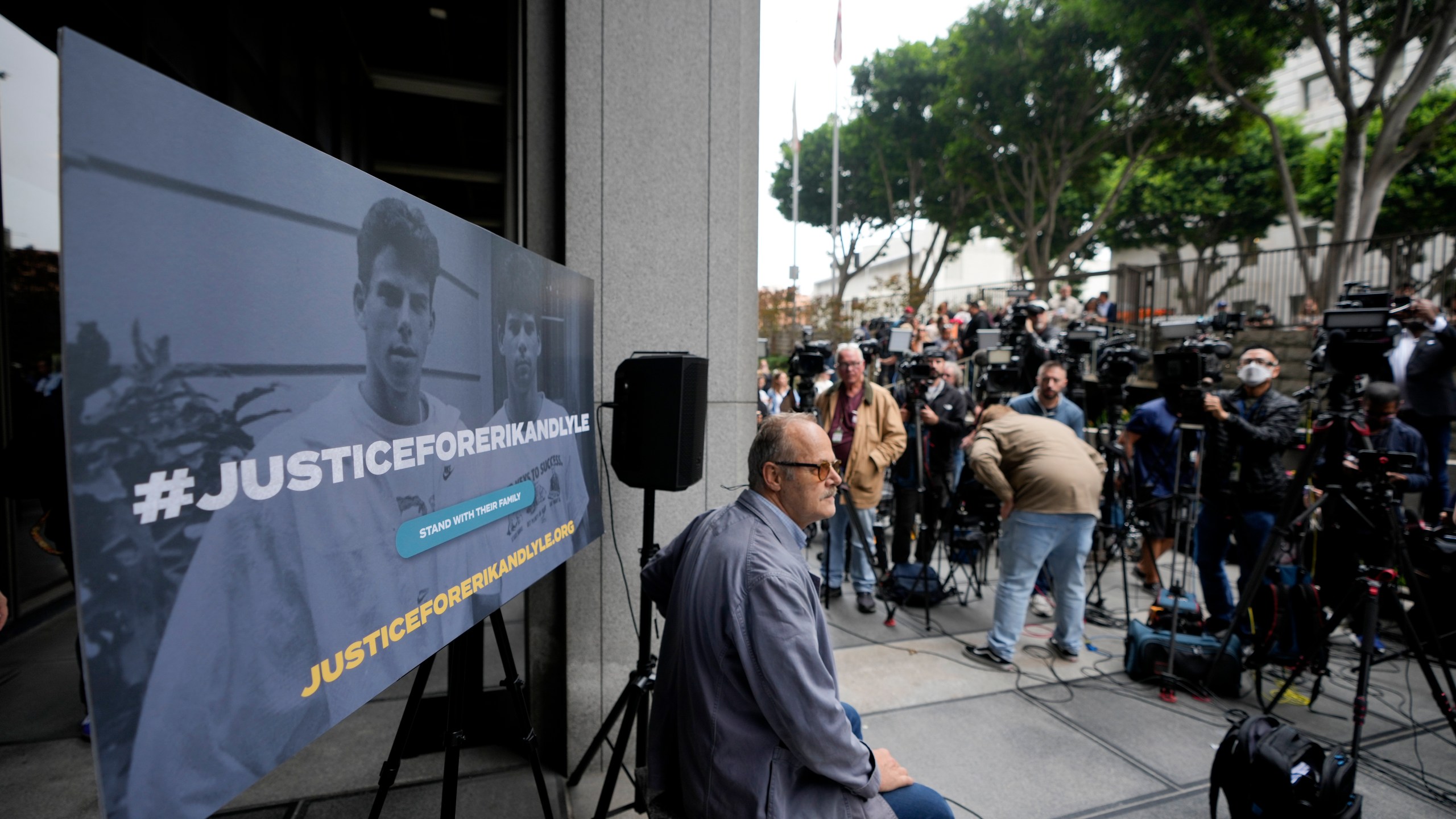 A sign is placed before a press conference to announce developments on the case of brothers Erik and Lyle Menendez, Wednesday, Oct. 16, 2024, in Los Angeles. (AP Photo/Damian Dovarganes)