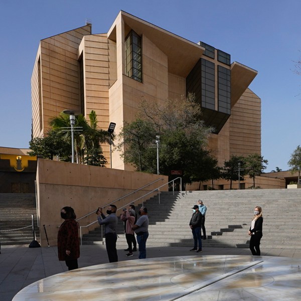 FILE - People attend a memorial service outside the Cathedral of Our Lady of Angels in Los Angeles, Jan. 19, 2021. (AP Photo/Damian Dovarganes,File)