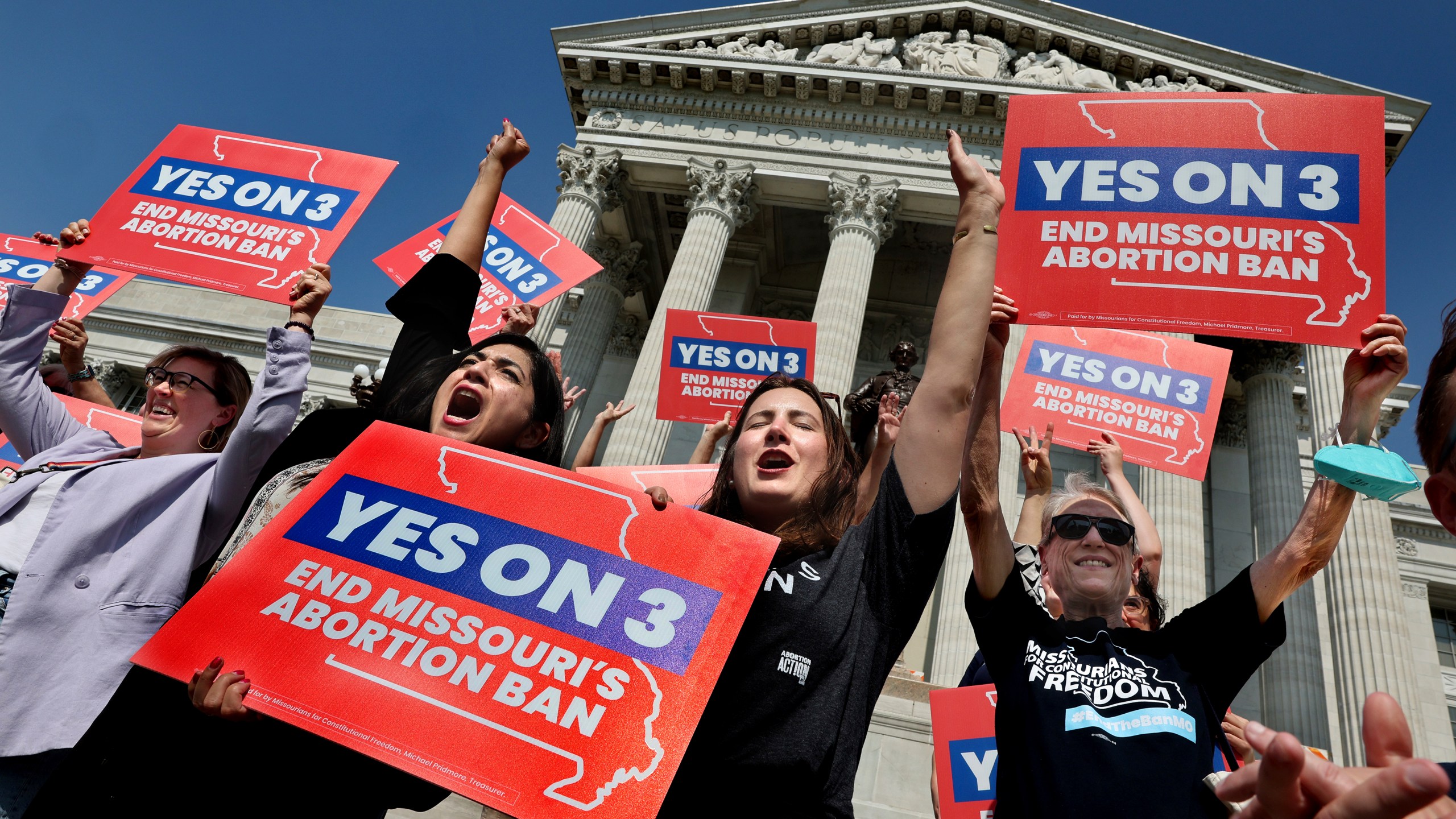 FILE - Amendment 3 supporters Luz Maria Henriquez, second from left, executive director of the ACLU Missouri, celebrates with Mallory Schwarz, center, of Abortion Action Missouri, after the Missouri Supreme Court in Jefferson City, Mo., ruled that the amendment to protect abortion rights would stay on the November ballot in on Tuesday, Sept. 10, 2024. (Robert Cohen/St. Louis Post-Dispatch via AP, File)