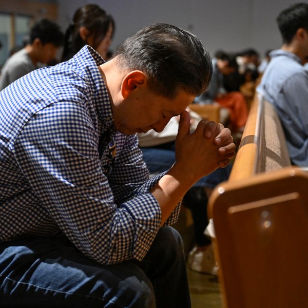 A parishioner prays during a service at the Christ Central Presbyterian Church, Sunday, Oct. 13, 2024 in Centreville. (AP Photo/John McDonnell)