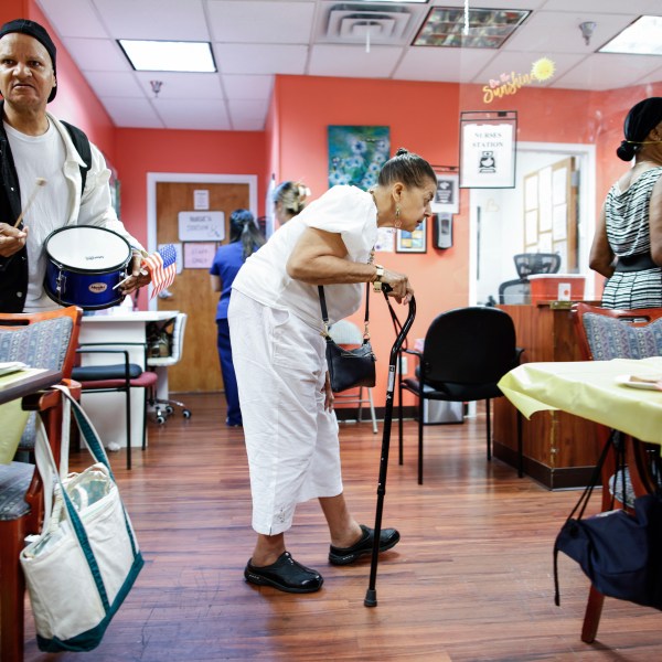 People take part in a multicultural parade inside Sunshine Adult Day Center in Bergenfield, N.J., Monday, Aug. 26, 2024. (AP Photo/Kena Betancur)