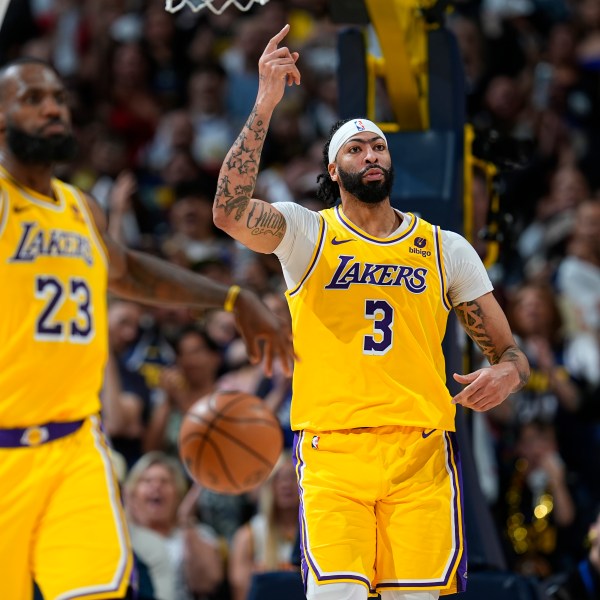 FILE - Los Angeles Lakers forwards LeBron James (23) and Anthony Davis (3) in the second half of Game 5 of an NBA basketball first-round playoff series Monday, April 29, 2024, in Denver. (AP Photo/David Zalubowski, File)