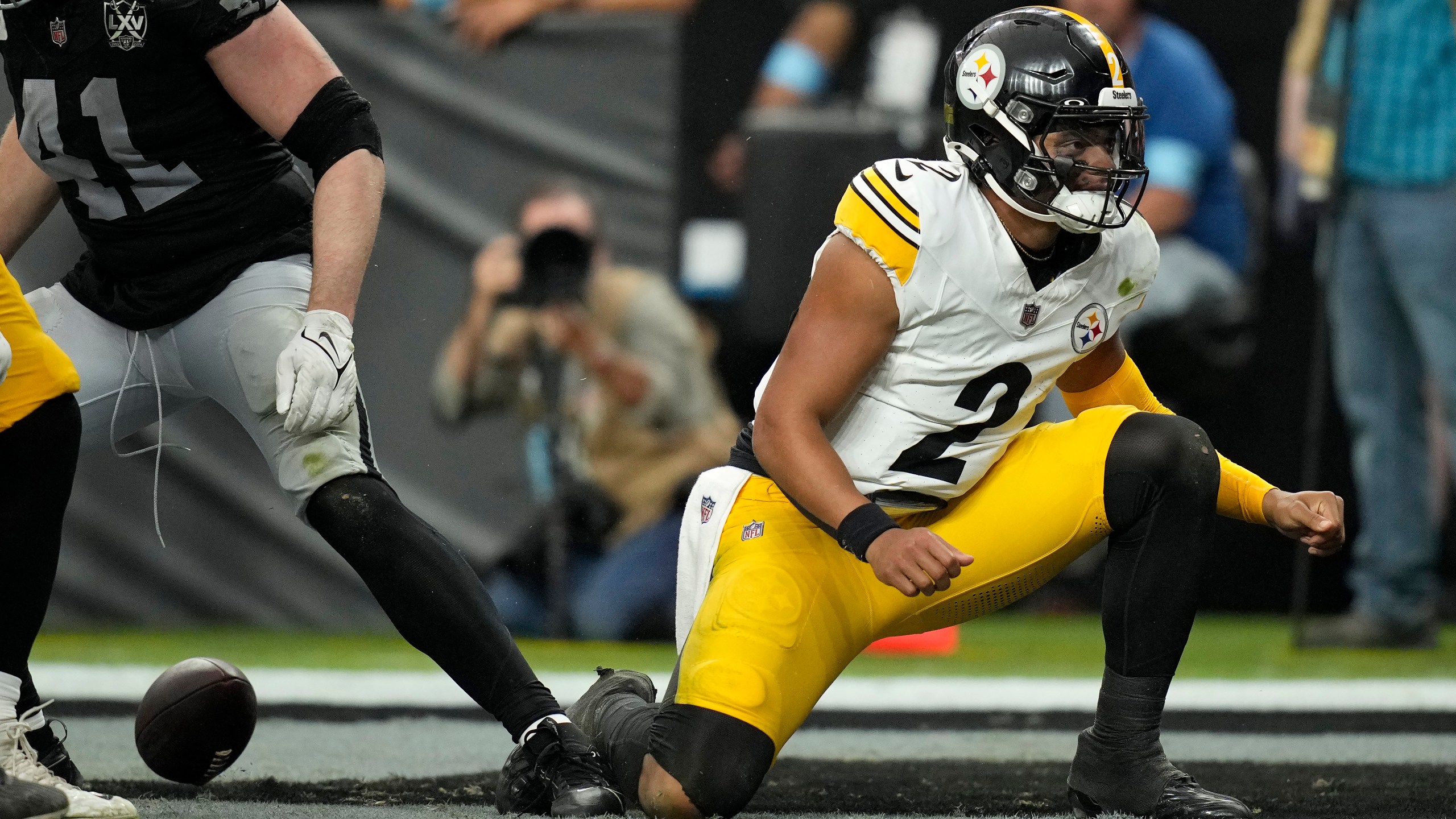 Pittsburgh Steelers quarterback Justin Fields (2) reacts after scoring against the Las Vegas Raiders during the second half of an NFL football game in Las Vegas, Sunday, Oct. 13, 2024. (AP Photo/John Locher)