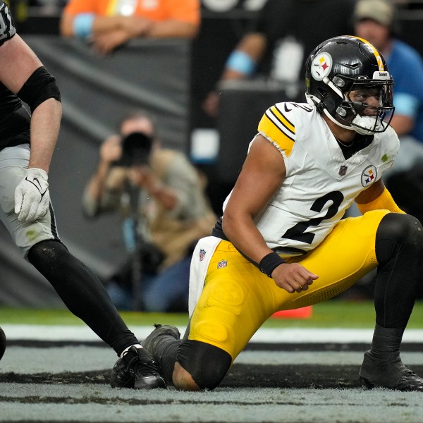 Pittsburgh Steelers quarterback Justin Fields (2) reacts after scoring against the Las Vegas Raiders during the second half of an NFL football game in Las Vegas, Sunday, Oct. 13, 2024. (AP Photo/John Locher)