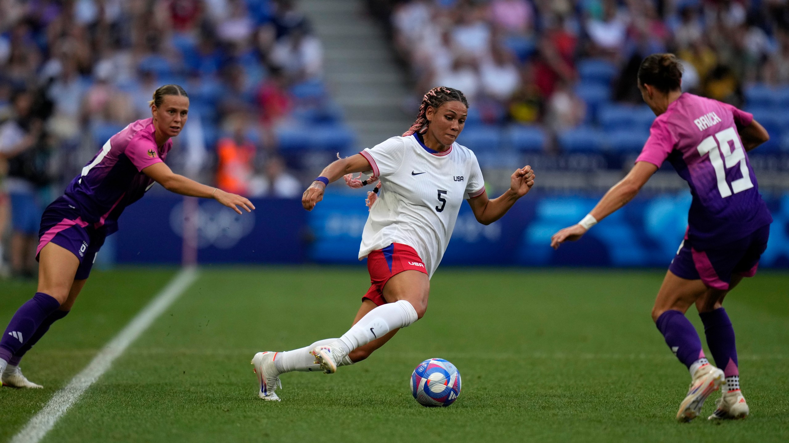 FILE - United States' Trinity Rodman fights for the ball with Germany's Felicitas Rauch during a women's semifinal soccer match between the United States and Germany at the 2024 Summer Olympics at Lyon Stadium in Decines, France, Aug. 6, 2024. (AP Photo/Silvia Izquierdo, File)