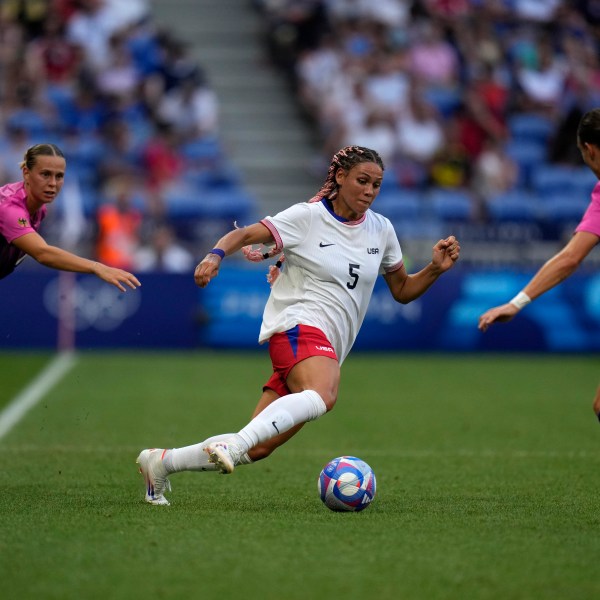 FILE - United States' Trinity Rodman fights for the ball with Germany's Felicitas Rauch during a women's semifinal soccer match between the United States and Germany at the 2024 Summer Olympics at Lyon Stadium in Decines, France, Aug. 6, 2024. (AP Photo/Silvia Izquierdo, File)