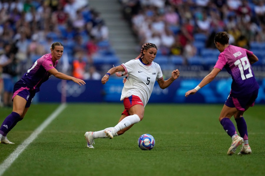 FILE - United States' Trinity Rodman fights for the ball with Germany's Felicitas Rauch during a women's semifinal soccer match between the United States and Germany at the 2024 Summer Olympics at Lyon Stadium in Decines, France, Aug. 6, 2024. (AP Photo/Silvia Izquierdo, File)