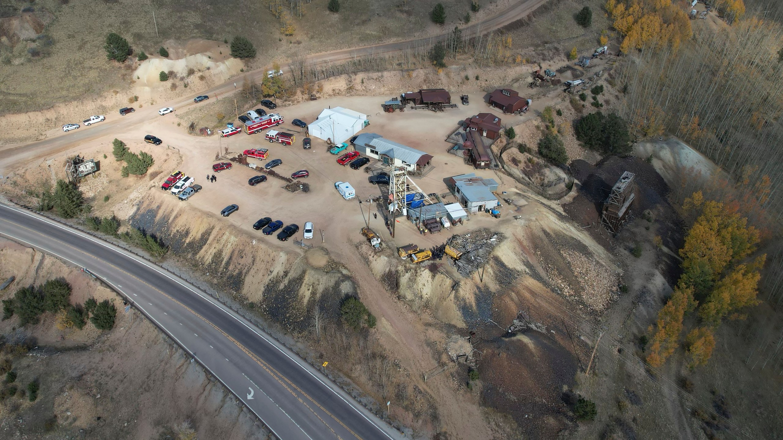 Emergency personnel stage outside the Mollie Kathleen Gold Mine in Cripple Creek, Colo., Thursday, Oct. 10, 2024, after one person died in an equipment malfunction during a tour of the mine according to the Teller County Sheriff's Department. (Arthur Trickette-Wile/The Gazette via AP)