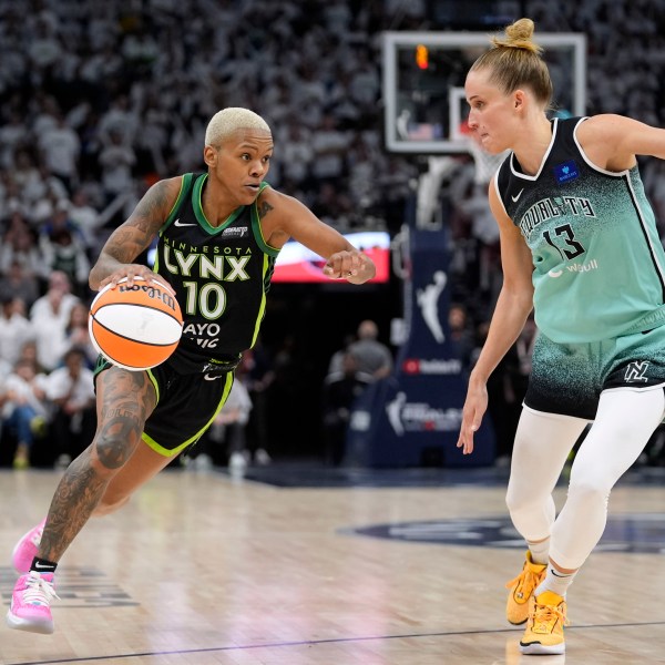 Minnesota Lynx guard Courtney Williams (10) drives past New York Liberty forward Leonie Fiebich (13) during the second half in Game 3 of a WNBA basketball final playoff series, Wednesday, Oct. 16, 2024, in Minneapolis. (AP Photo/Abbie Parr)