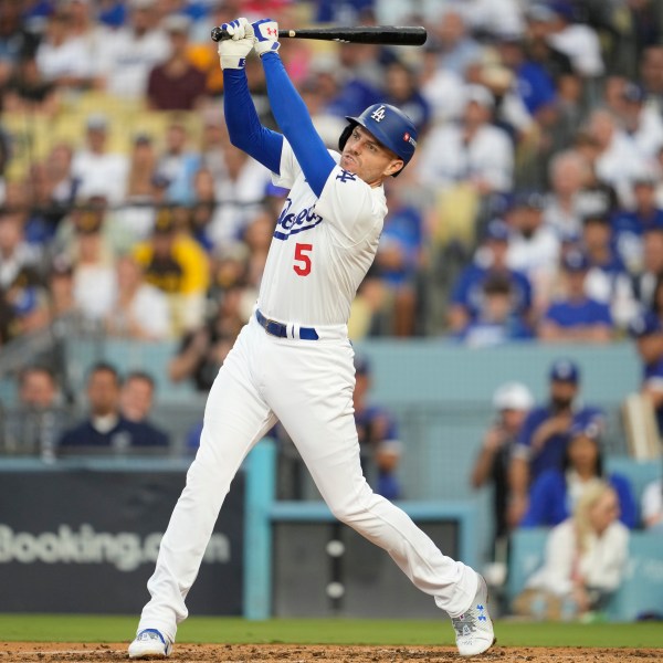 Los Angeles Dodgers' Freddie Freeman flies out during the fourth inning in Game 5 of a baseball NL Division Series against the San Diego Padres, Friday, Oct. 11, 2024, in Los Angeles. (AP Photo/Ashley Landis)