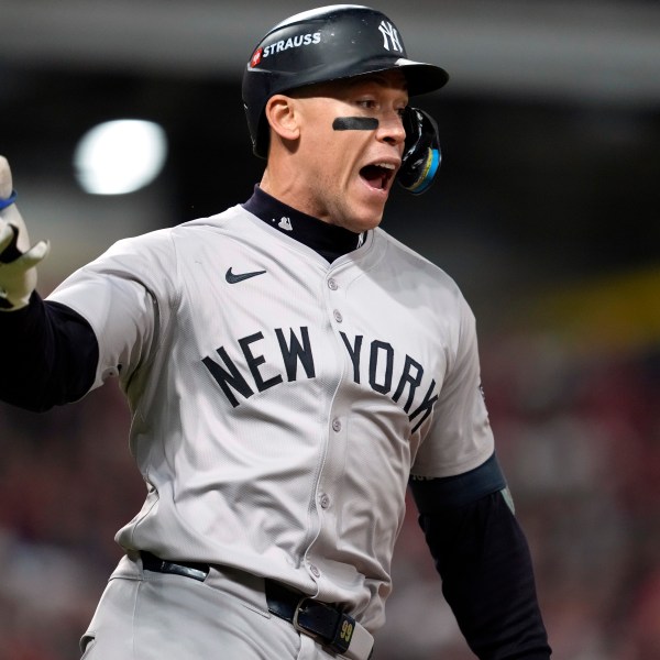 New York Yankees' Aaron Judge celebrates after hitting a two-run home run against the Cleveland Guardians during the eighth inning in Game 3 of the baseball AL Championship Series Thursday, Oct. 17, 2024, in Cleveland.(AP Photo/Godofredo Vásquez )