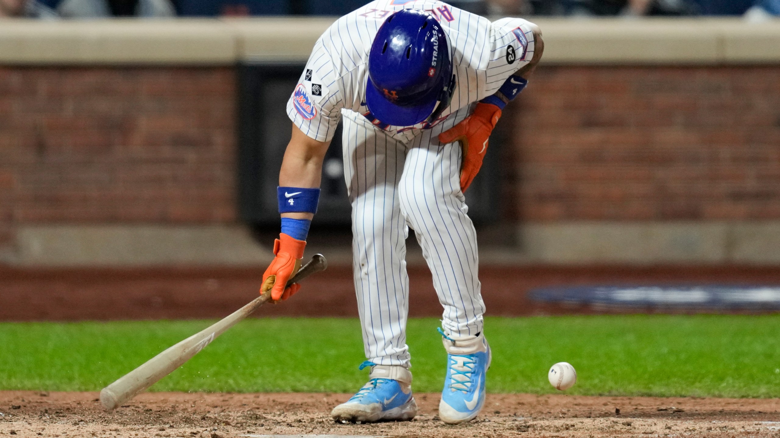 New York Mets' Francisco Alvarez gets hit by pitch against the Los Angeles Dodgers during the fifth inning in Game 4 of a baseball NL Championship Series, Thursday, Oct. 17, 2024, in New York. (AP Photo/Ashley Landis)