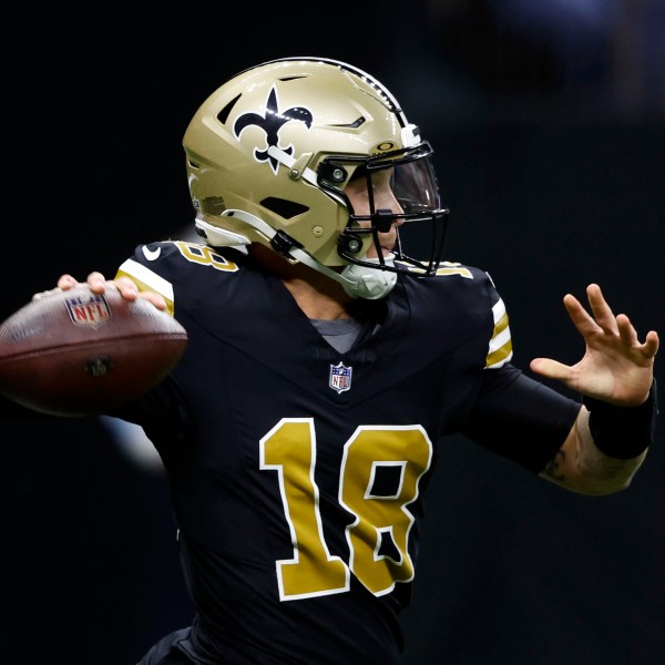 New Orleans Saints quarterback Spencer Rattler throws a pass during the first half of an NFL football game against the Denver Broncos, Thursday, Oct. 17, 2024, in New Orleans. (AP Photo/Butch Dill)