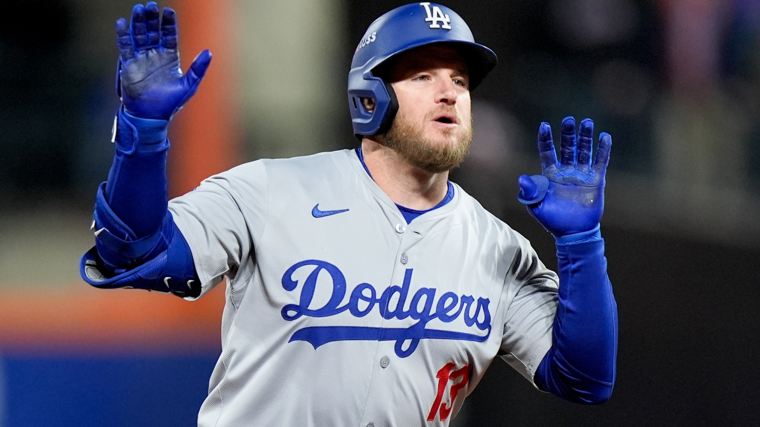 Los Angeles Dodgers' Max Muncy celebrates a home run against the New York Mets during the ninth inning in Game 3 of a baseball NL Championship Series, Wednesday, Oct. 16, 2024, in New York. (AP Photo/Frank Franklin II)