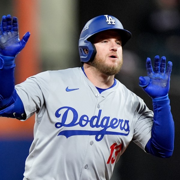 Los Angeles Dodgers' Max Muncy celebrates a home run against the New York Mets during the ninth inning in Game 3 of a baseball NL Championship Series, Wednesday, Oct. 16, 2024, in New York. (AP Photo/Frank Franklin II)