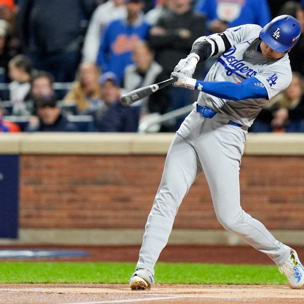 Los Angeles Dodgers' Shohei Ohtani hits a home run against the New York Mets during the first inning in Game 4 of a baseball NL Championship Series, Thursday, Oct. 17, 2024, in New York. (AP Photo/Frank Franklin II)