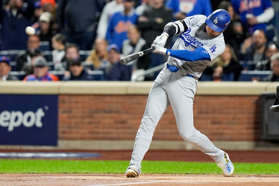 Los Angeles Dodgers' Shohei Ohtani hits a home run against the New York Mets during the first inning in Game 4 of a baseball NL Championship Series, Thursday, Oct. 17, 2024, in New York. (AP Photo/Frank Franklin II)