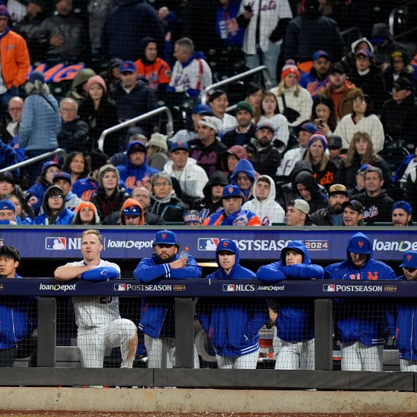 New York Mets watch during the ninth inning in Game 4 of a baseball NL Championship Series against the Los Angeles Dodgers, Thursday, Oct. 17, 2024, in New York. (AP Photo/Frank Franklin II)