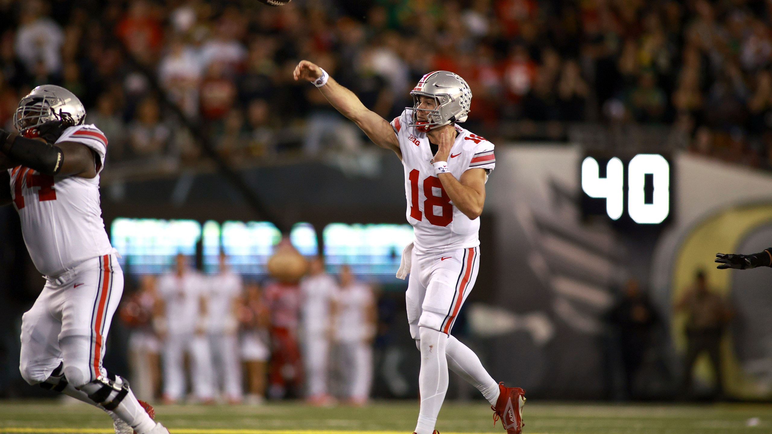 Ohio State quarterback Will Howard (18) passes the ball during an NCAA college football game against Oregon, Saturday, Oct. 12, 2024, in Eugene, Ore. (AP Photo/Lydia Ely)