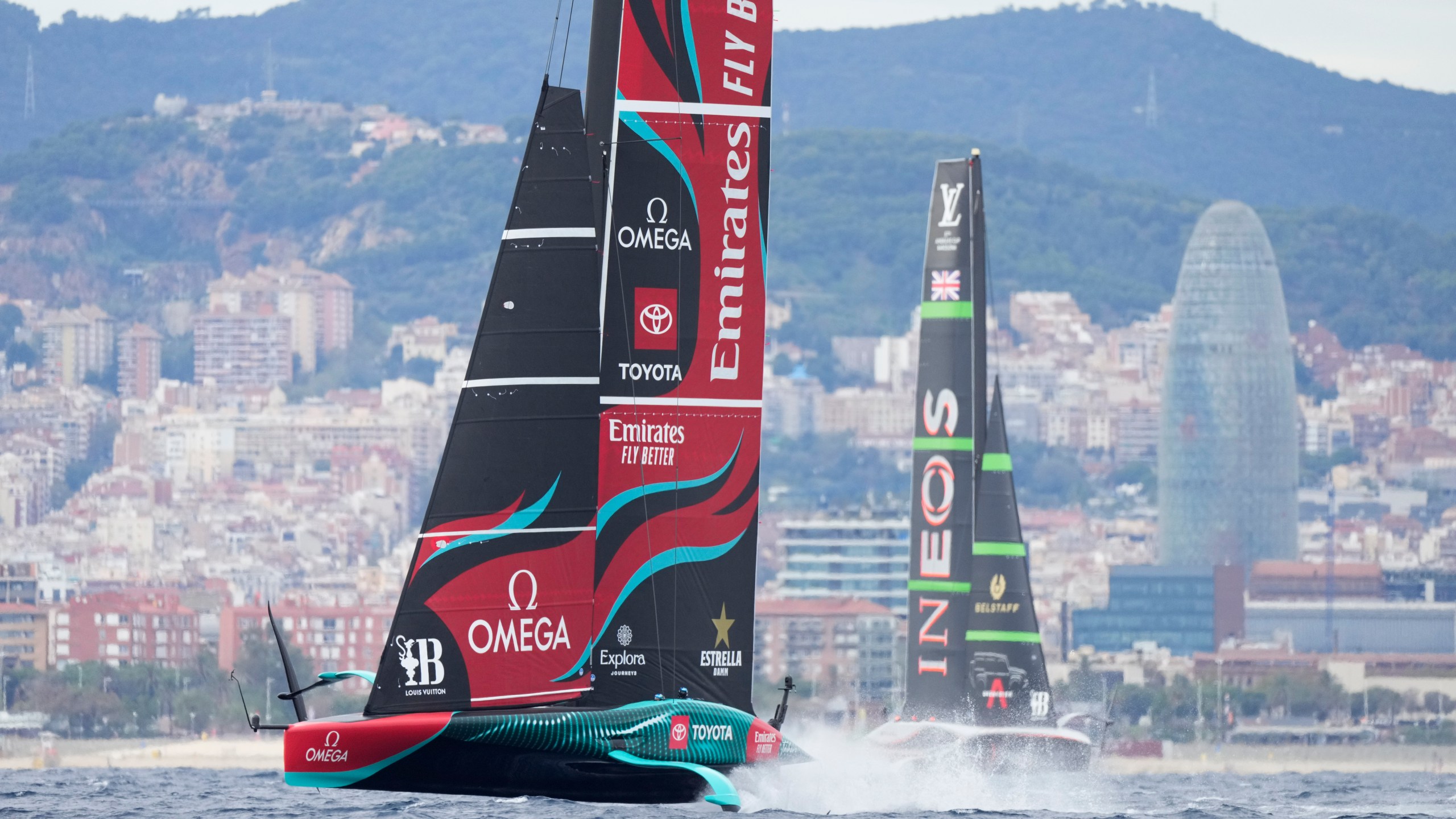 Ineos Britannia and Emirates Team New Zealand race during Louis Vuitton 37th America's Cup Day 5 race 8 in Barcelona, Spain, Friday, Oct. 18, 2024. (AP Photo/Bernat Armangue)