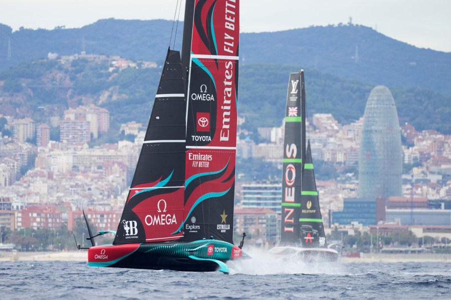 Ineos Britannia and Emirates Team New Zealand race during Louis Vuitton 37th America's Cup Day 5 race 8 in Barcelona, Spain, Friday, Oct. 18, 2024. (AP Photo/Bernat Armangue)