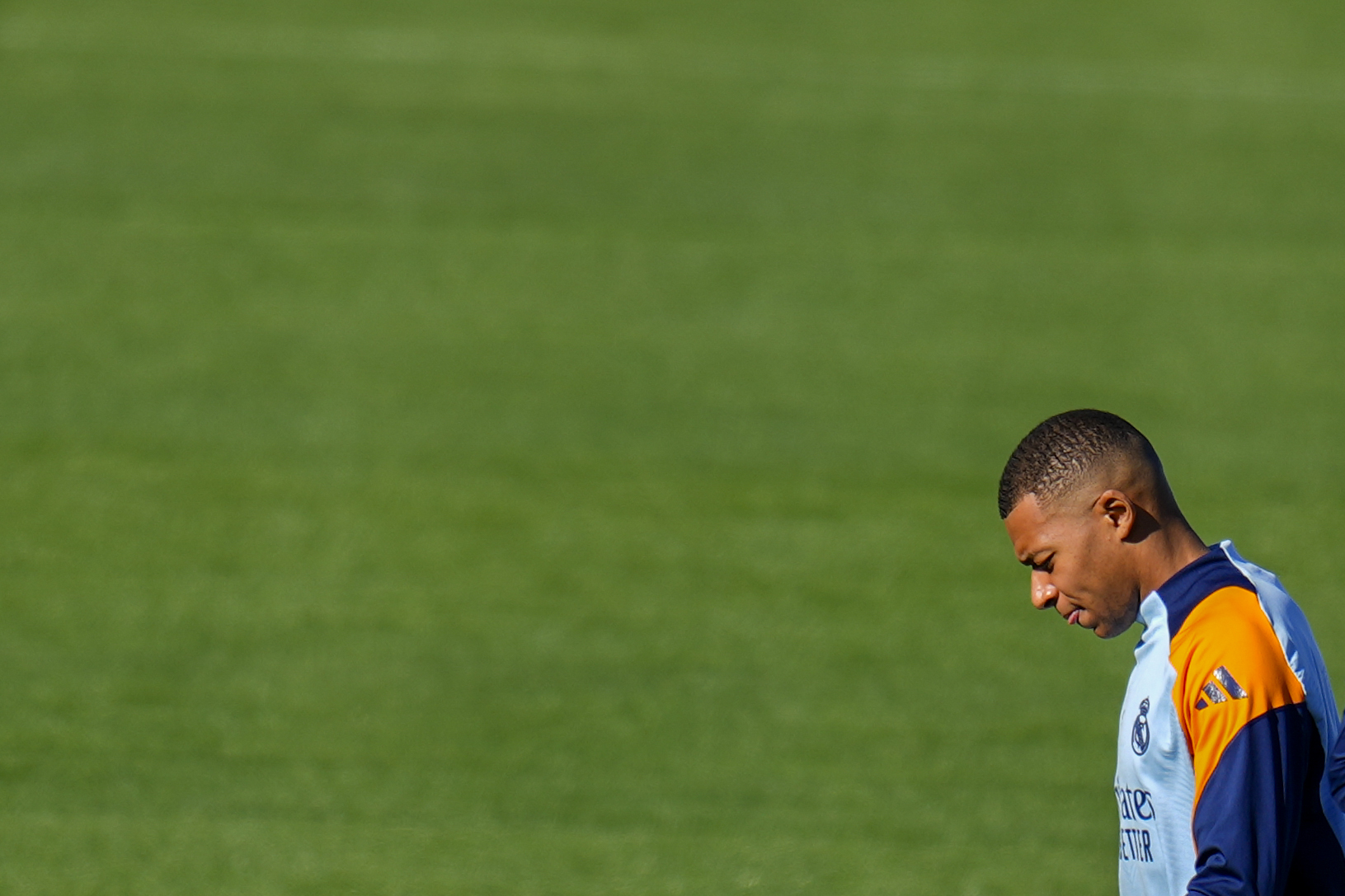 Real Madrid's Kylian Mbappe looks down during a training session at Real Madrid's Valdebebas training ground in Madrid, Spain, Friday, Oct. 18, 2024. (AP Photo/Manu Fernandez)