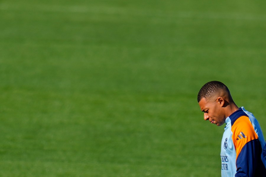 Real Madrid's Kylian Mbappe looks down during a training session at Real Madrid's Valdebebas training ground in Madrid, Spain, Friday, Oct. 18, 2024. (AP Photo/Manu Fernandez)