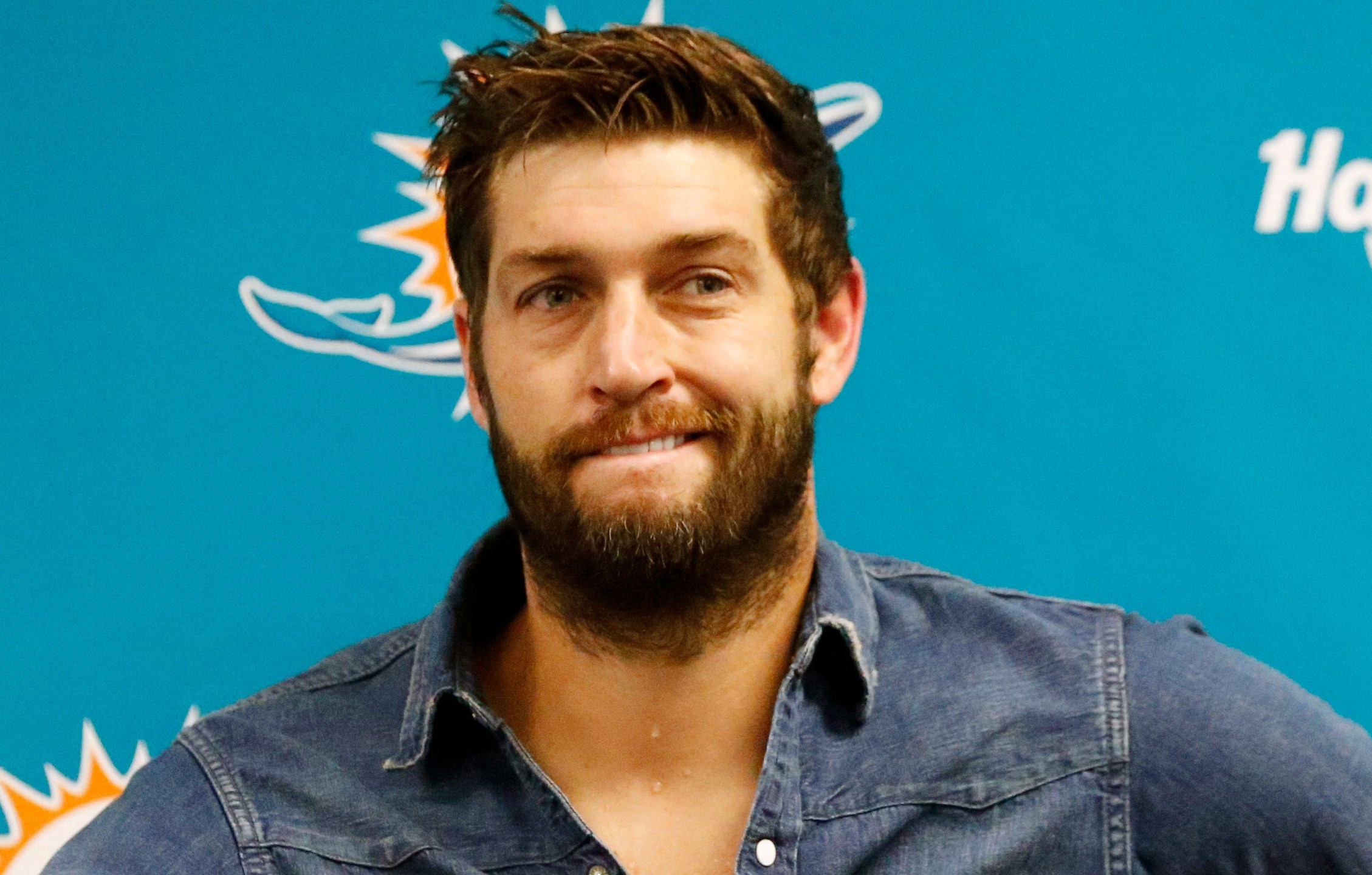 FILE - Miami Dolphins quarterback Jay Cutler smiles during a post game news conference following an NFL football game against the New England Patriots, Tuesday, Dec. 12, 2017, in Miami Gardens, Fla. (AP Photo/Wilfredo Lee, File)