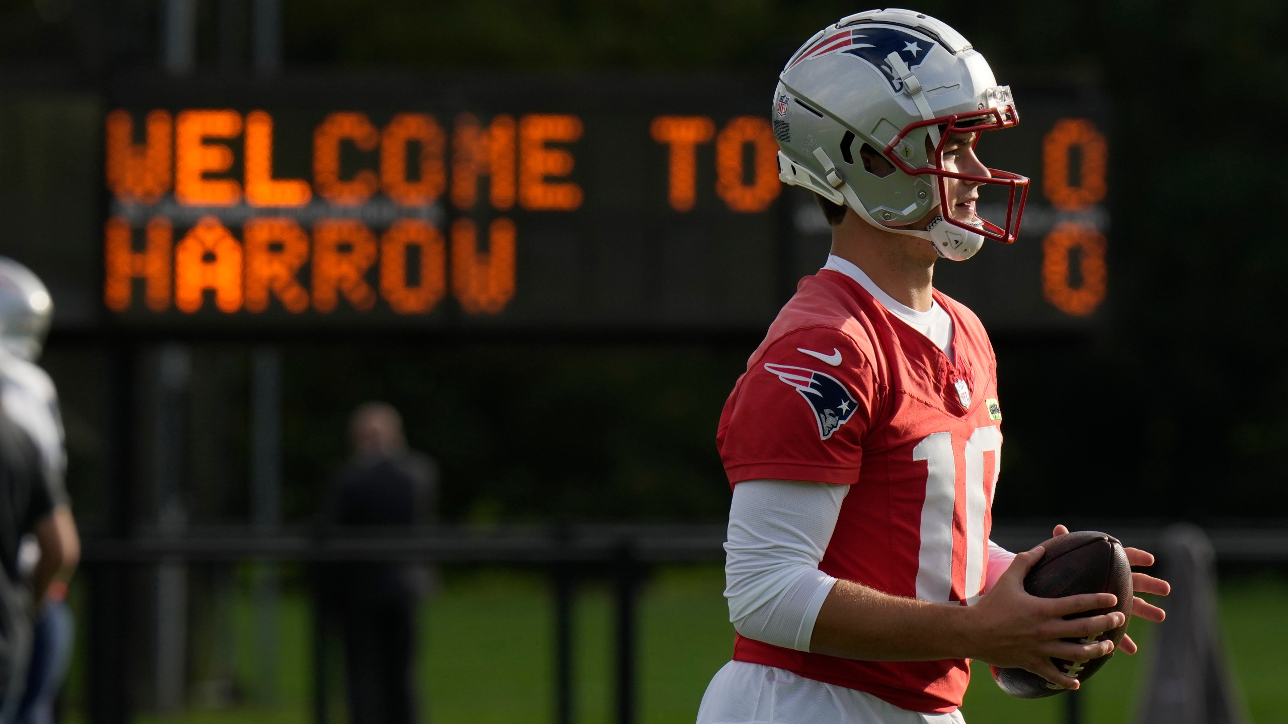 New England Patriots quarterback Drake Maye (10) works out during NFL football practice, Friday, Oct. 18, 2024, in Harrow, England. (AP Photo/Steve Luciano)