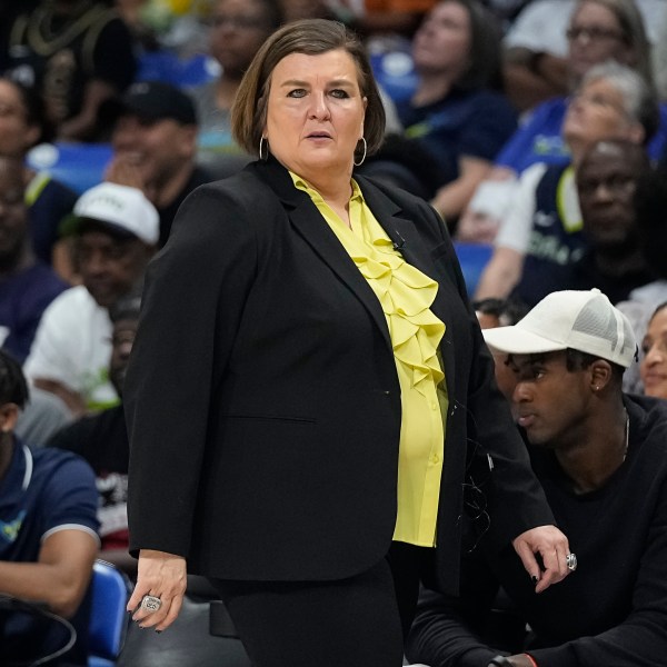 FILE - Dallas Wings head coach Latricia Trammell walks along the court during the second half of Game 3 of a WNBA basketball playoffs semifinal against the Las Vegas Aces, Sept. 29, 2023, in Arlington, Texas. (AP Photo/Sam Hodde, File)