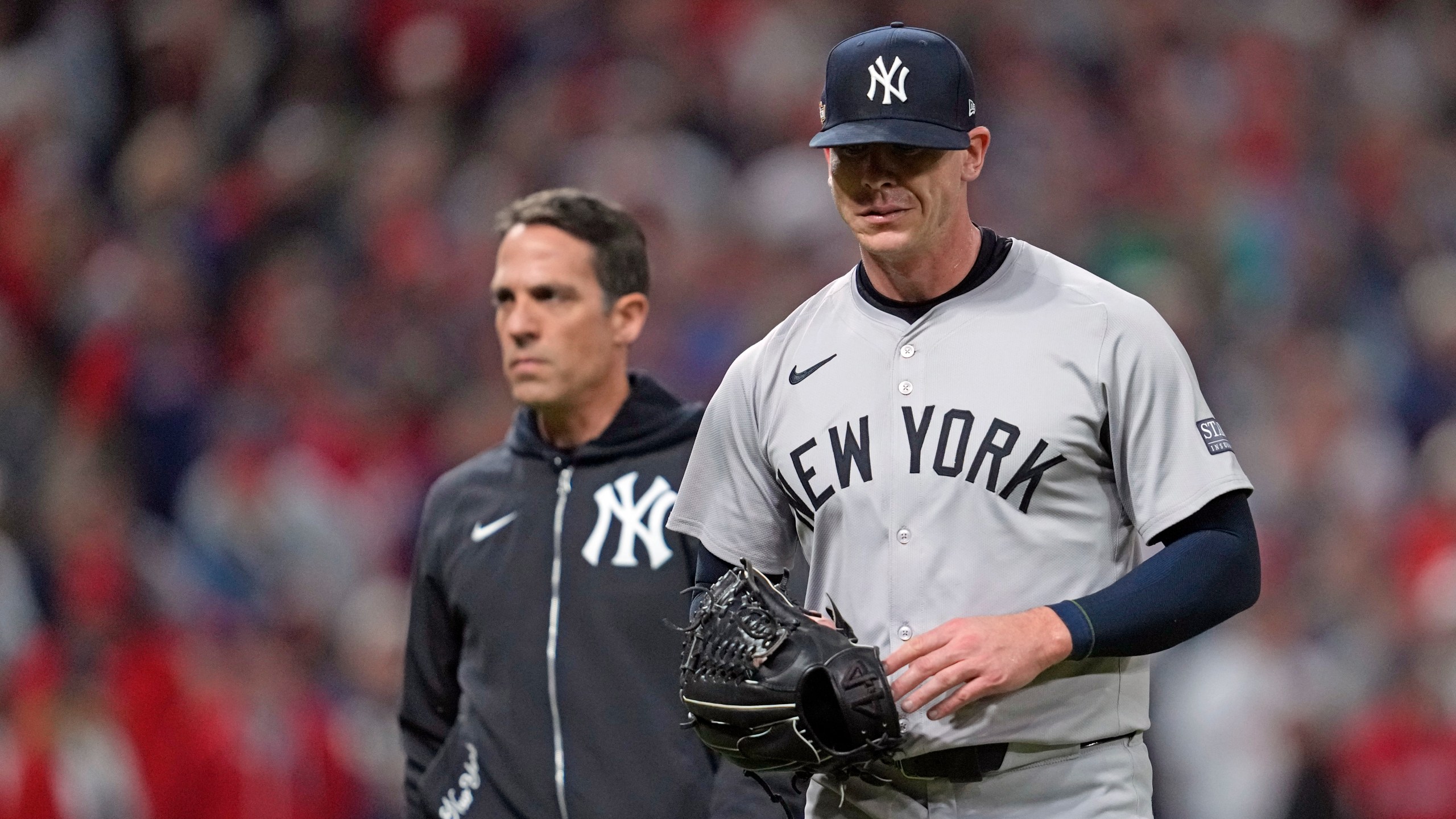 New York Yankees relief pitcher Ian Hamilton leaves during the sixth inning in Game 3 of the baseball AL Championship Series against the Cleveland Guardians Thursday, Oct. 17, 2024, in Cleveland.(AP Photo/Godofredo Vásquez )