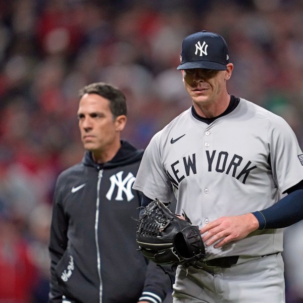 New York Yankees relief pitcher Ian Hamilton leaves during the sixth inning in Game 3 of the baseball AL Championship Series against the Cleveland Guardians Thursday, Oct. 17, 2024, in Cleveland.(AP Photo/Godofredo Vásquez )